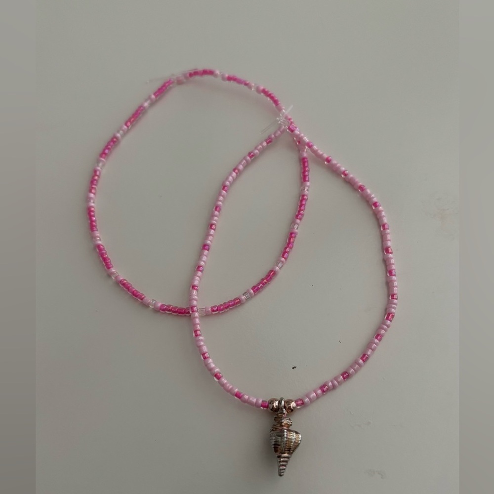 Homemade pink anklets with conch seashell charm